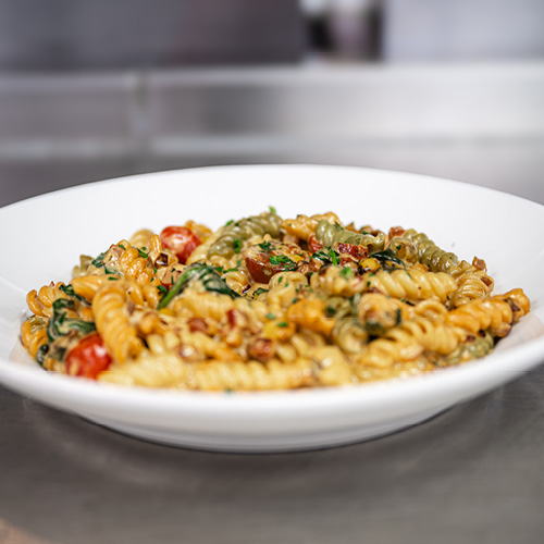 bowl of a pasta meal on a white dish