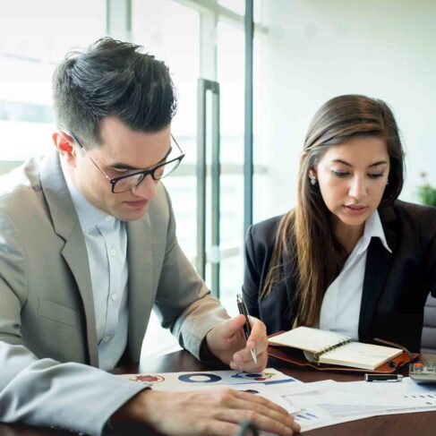 Businessman and businesswoman discuss together about the appeals process in government.