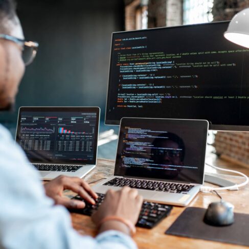 Male programmer working on his code at home.
