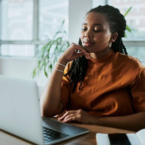 A business woman working on her laptop computer.