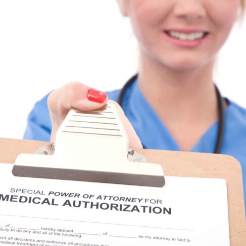 friendly female doctor with medical authorization form