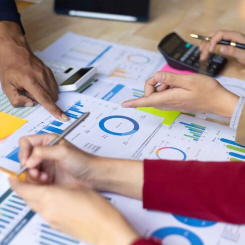 Business meeting, Financial consultants discuss investment growth chart analysis in company financial reports and are planning marketing business strategies.