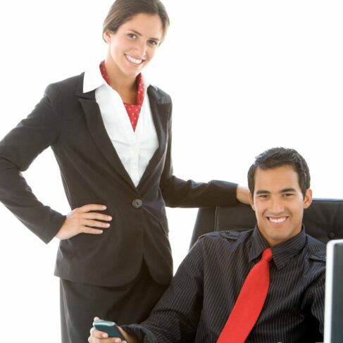 Senior old executive manager working with young businesspeople in office meeting room. Old man is the company leader sitting with secretary and translator. International corporate business concept.