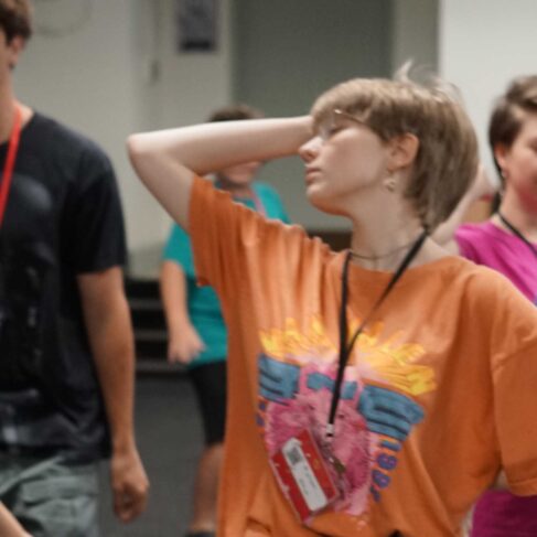 Students acting in a classroom.