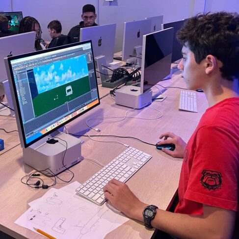 Student looking at a computer screen with an outdoor image