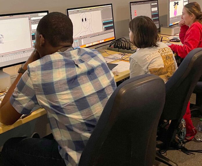 Students looking at a computer screen with images