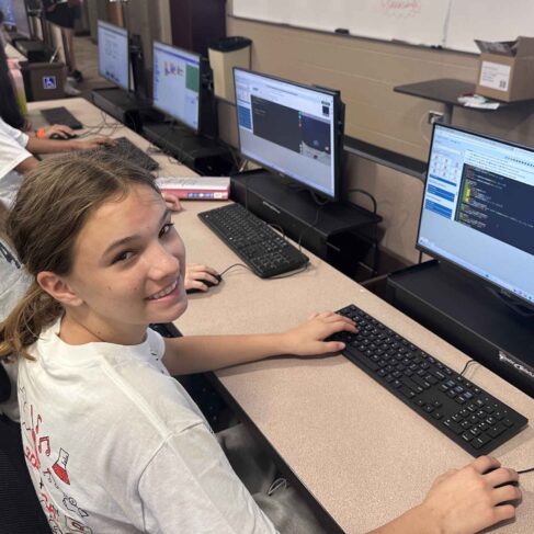 Group of students sitting in front of computers