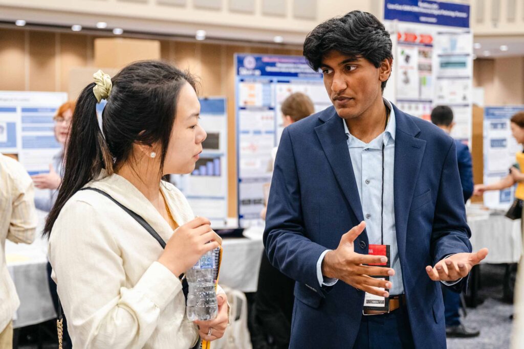 A woman and a man talking about a display at the Georgia Science and Engineering Fair at the Classic Center