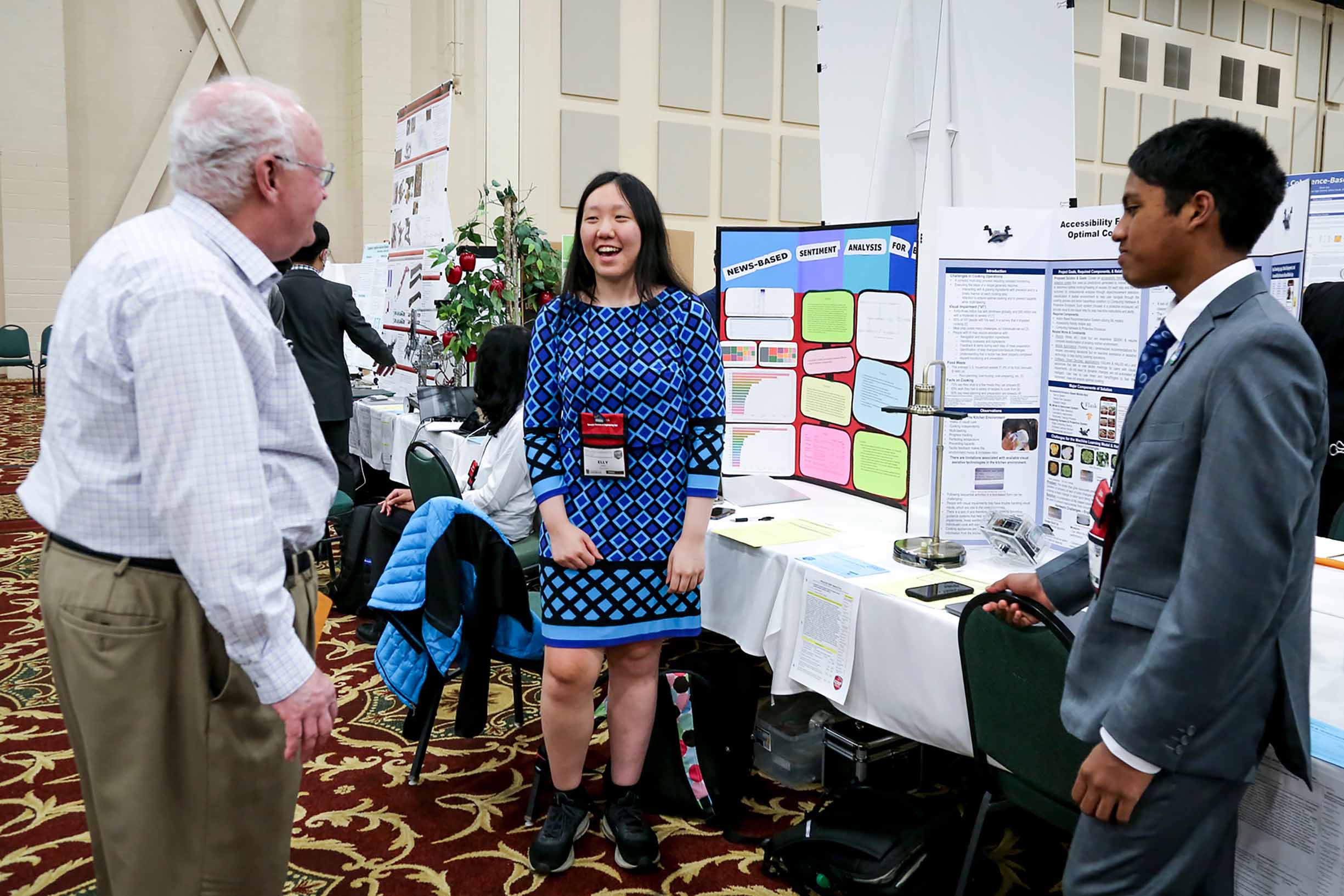 Student talking to a judge about her science project