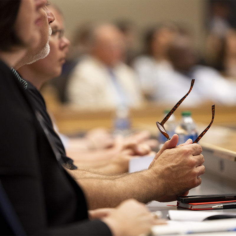 Detail of attendees listening during the Electric Mobility Summit at the Georgia Center.