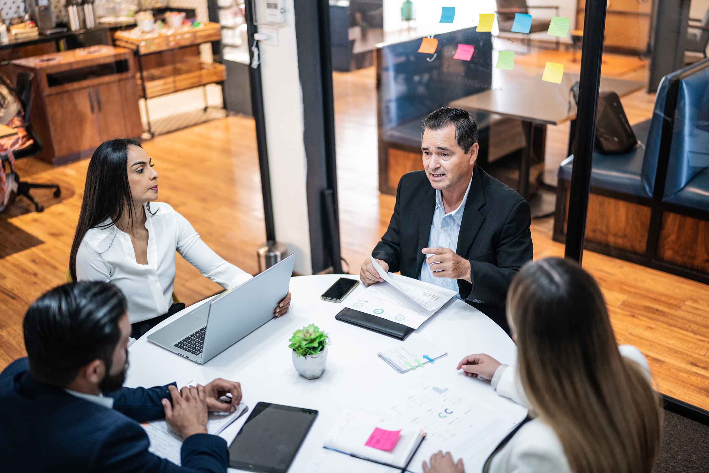 Businessman talking to coworkers on a meeting at office