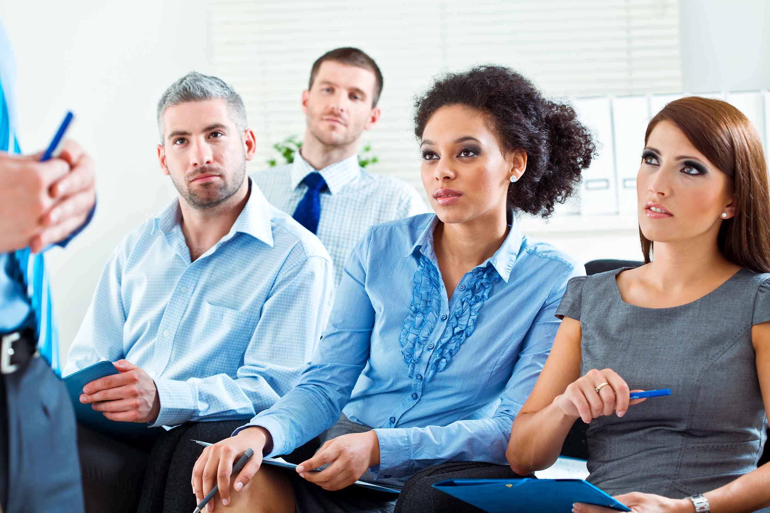 Business people attending seminar.