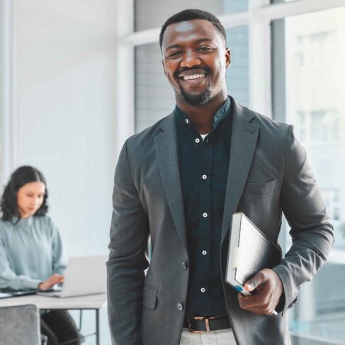 Business man, portrait and happy in office for legal career, planning and confidence at a law firm.