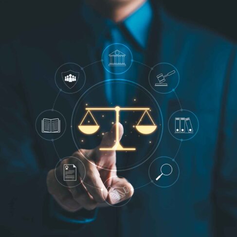 A suited legal professional touches virtual icons symbolizing law, justice, and legal services.