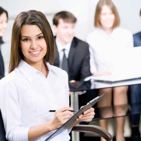 Young business woman and her team