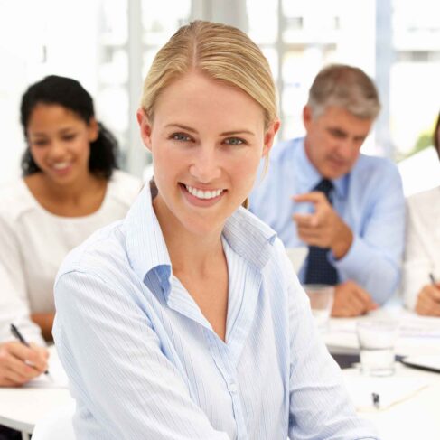 Recruitment office meeting with colleague smiling to camera