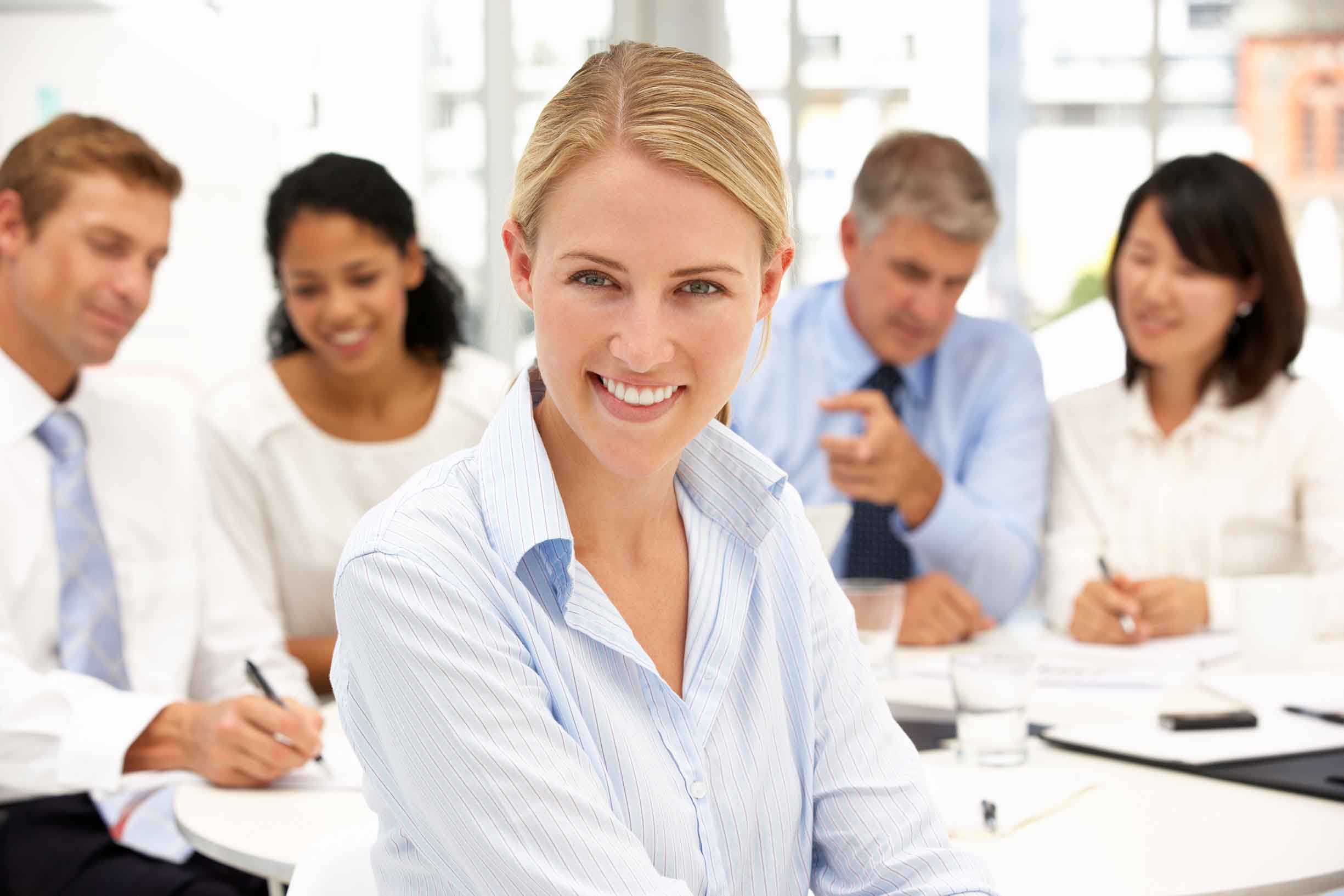 Recruitment office meeting with colleague smiling to camera