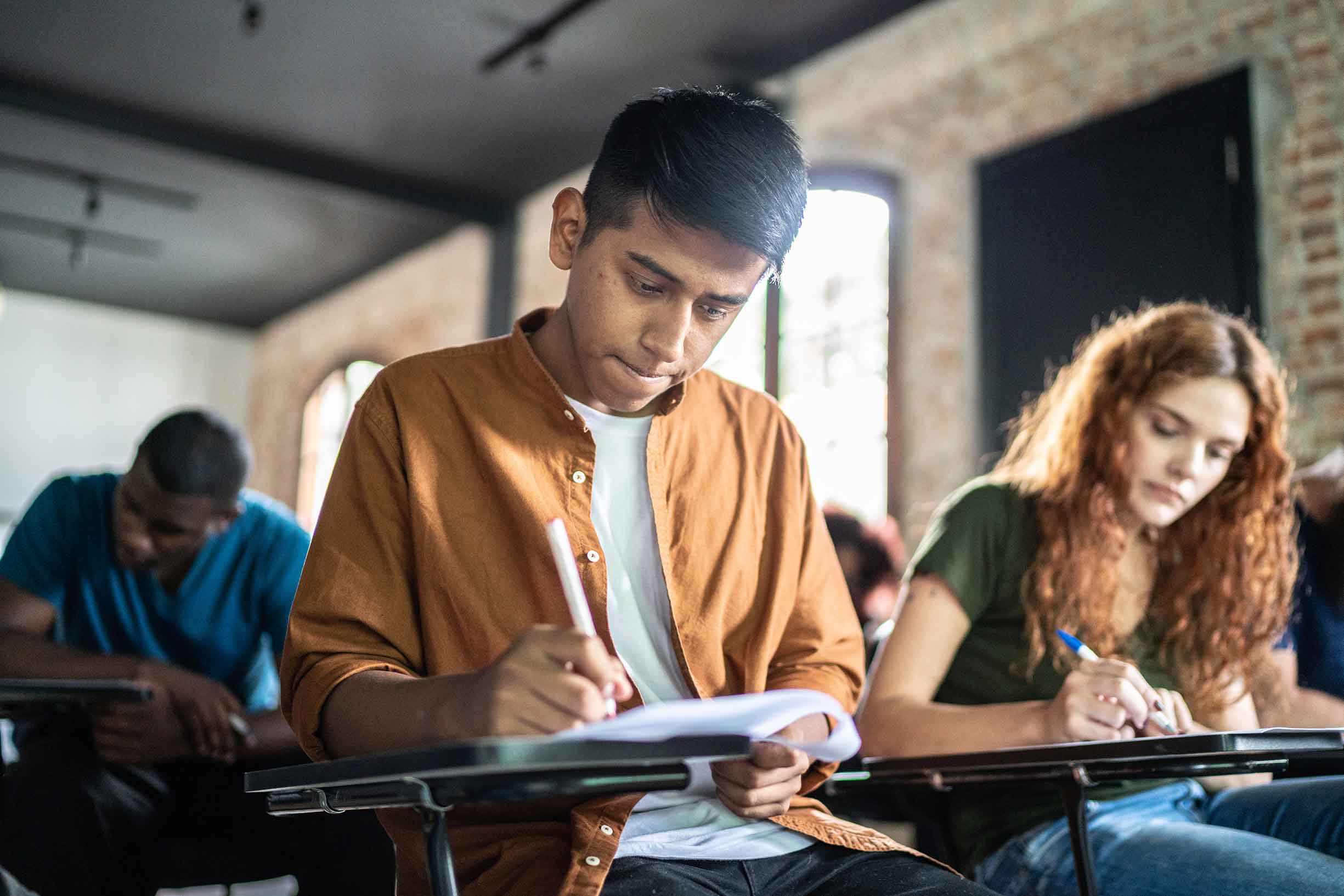 Focused student doing test during a class