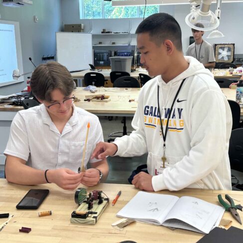 two students working on a engineering project during summer camp at UGA