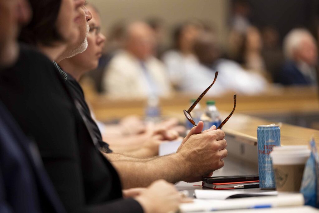 Detail of attendees listening during the Electric Mobility Summit at the Georgia Center.