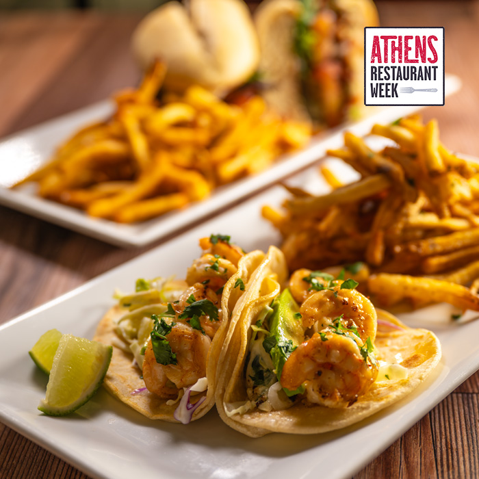 View of shrimp tacos and fries on a white plate with the Athens Restaurant Week logo in top right corner