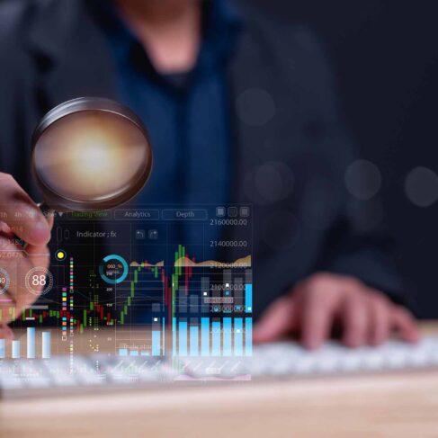 Professional examines financial graphs on digital interface, symbolizing data analysis and market research, highlighting importance of informed decision-making in trading