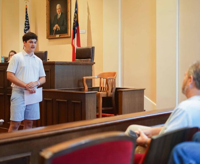 A student addressing the jury in a mock trial