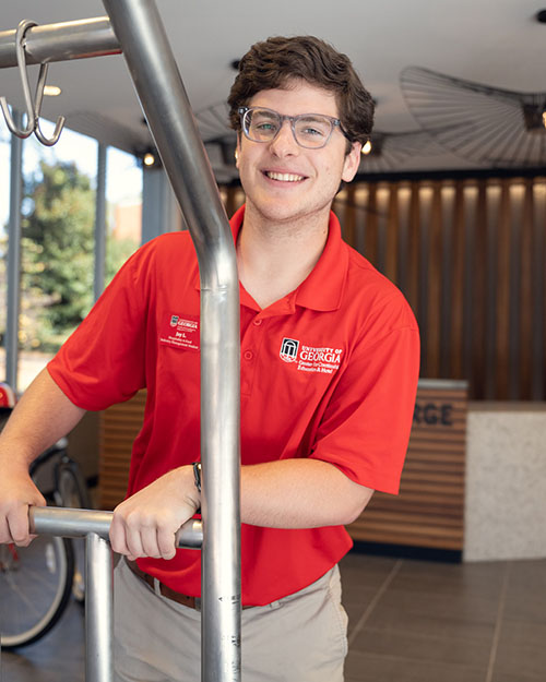 Working the concierge desk, Lavender, a Statham, Ga., native helps incoming guests with their luggage.