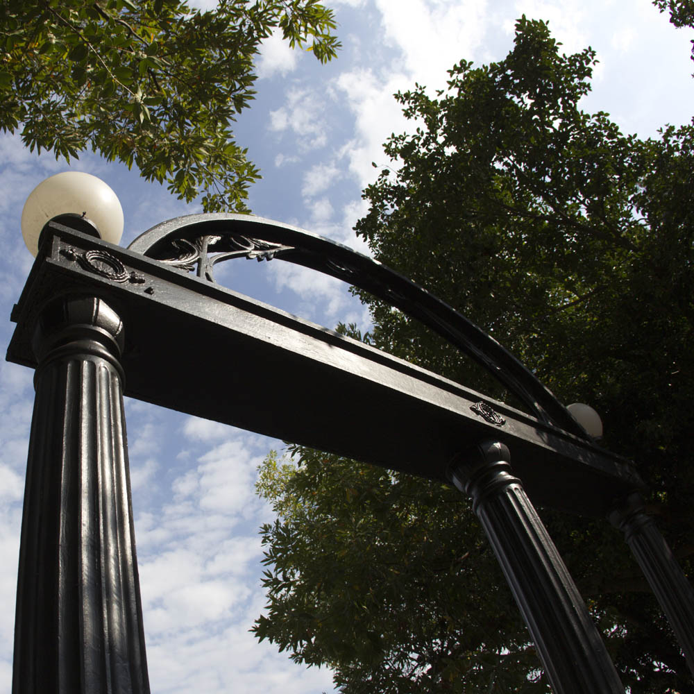 Arch image of the Arch with green foliage framing the structure. The Arch is the traditional entrance to the University of Georgia campus.