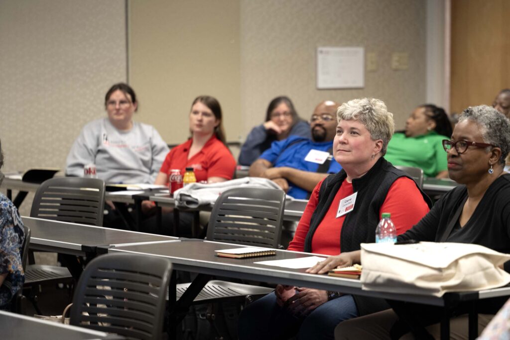 A group of people attending the Administrative Professional Conference at the Georgia Center.