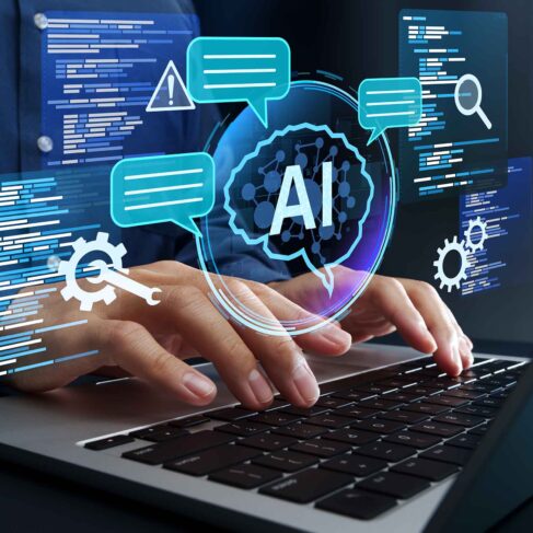 Programmer using AI to generate code for creating applications on laptop